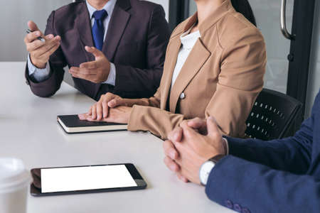 Confident business leader, business team meeting conference in office, The senior executive working and discussing new project investment plan with Secretary and strategy in business profit.の写真素材