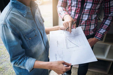 Architecture Engineer Teamwork Meeting, Drawing and working for architectural project and engineering tools on workplace, concept of work on technical drawings.の写真素材