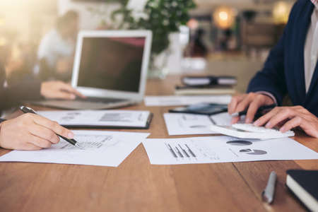 Startup business people group meeting, Young creative coworkers team working and discussing new plan project in office, entrepreneurs, brainstorming, Teamwork, analyze plans, professional investor.の写真素材