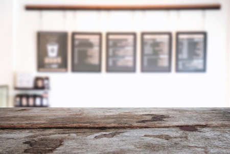 Empty wooden table and blur background of abstract in front of restaurant or coffee shop, cafe  can be used Mock up for display of product or for montage.の写真素材