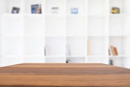 Empty wooden table and blur background of abstract in front of modern library or knowledge source can be used Mock up for display of product or for montage.の写真素材