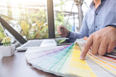 Creative creativity graphic designer working with graphics tablet,laptop and smart phone, colour...