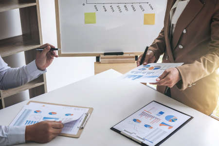 Business people discussion, Executive team discussing the charts and graphs working in business strategy and financial plan to investment profit.の写真素材