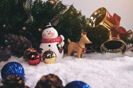 Christmas decoration Holiday or new year with Santa Claus and snowman on snow background and copy space.の写真素材