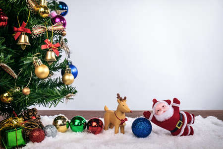Christmas decoration Holiday or new year with Santa Claus and snowman on snow background and copy space.の写真素材