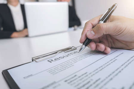 Employment and recruitment concept, Board reading a resume during a job interview and candidate sign contract for new colleagues in company, achievement approve.の写真素材