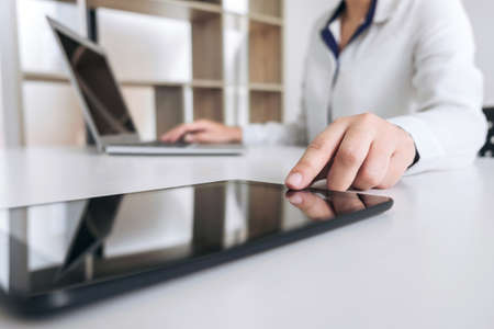 Business woman working and using laptop computer, digital tablet, business and technology concept.