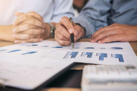 Business team two executive colleagues discussing and analysis working Financial investment on...
