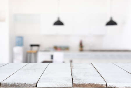 Empty wooden table and blurred background of abstract in front of restaurant or coffee shop for...