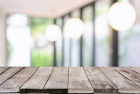 Selected focus Empty wooden table and blurred background of abstract in front of coffee shop or restaurant for display of product or for montage.の写真素材