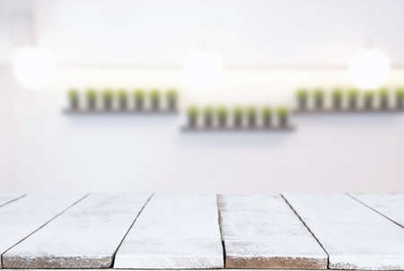 Selected focus Empty wooden table and blurred background of abstract in front of coffee shop or...