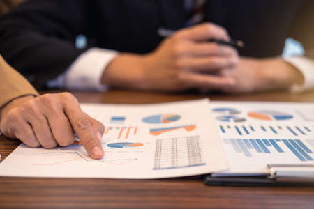 Business team meeting working with new startup project, discussion and analysis data the charts and...