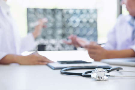 Professor Doctor discussion a method with patient treatment, results on brain x-ray film About the...