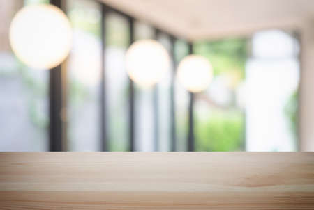 Selected focus Empty wooden table and blurred background of abstract in front of coffee shop or restaurant for display of product or for montage.の写真素材