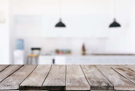 Empty wooden table and blurred background of abstract in front of restaurant or coffee shop for...