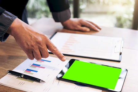 Professional business woman working, Doing finance on digital tablet, document graph and analysis business strategy to development profit.の写真素材