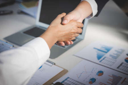 Teamwork process, Image of business team greeting handshake. Successful business people handshaking after good deal, success, dealing, greeting & business partner.の写真素材