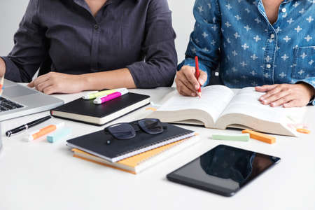 Images of Disappointed, Young students campus or classmates helps friend catching up workbook and...