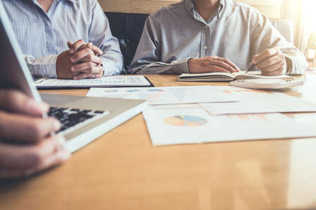 Business team meeting working with new startup project, discussion and analysis data graph report, business market growth on workplace, professional occupation, Partner meetings and collaboration.の写真素材