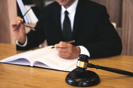 Judge gavel with Justice lawyers, Businessman in suit or lawyer working on a documents. Legal law,...