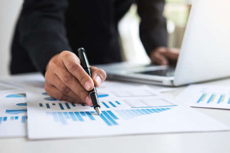 Business Financing Accounting Banking Concept, business woman using laptop and doing finances, calculate about cost to real estate investment and in other, tax system.の写真素材