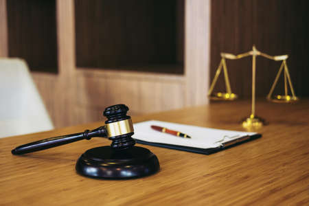 Judge gavel with Justice lawyers, object documents working on table. Legal law, advice and justice concept.の写真素材