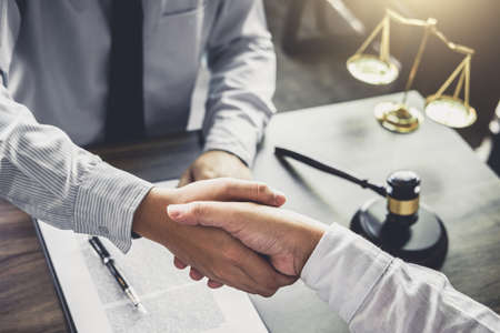 Handshake after good cooperation, Businessman handshake male lawyer after discussing good deal of Trading contract and new projects for the company of real estate, Meeting and greeting concept.の写真素材