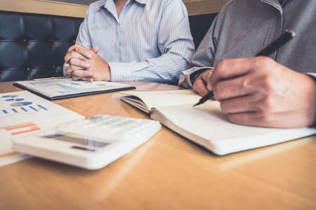 Business team meeting working with new startup project, discussion and analysis data graph report, business market growth on workplace, professional occupation, Partner meetings and collaboration.の写真素材