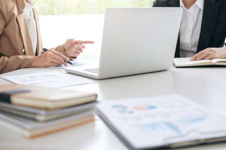 Business team meeting working with new startup project, discussion and analysis data the charts and...