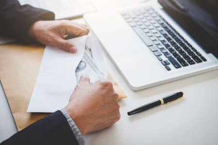 Money in human hands form of dollar bills, Businessman is counting money.の写真素材