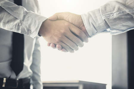 Handshake after good cooperation, Two Businessman handshake after discussing good deal of Trading...