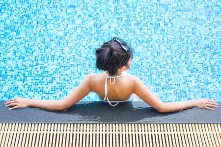 Summer fun in holiday, Happy beautiful woman lifestyle relaxing in luxury swimming pool, summer...