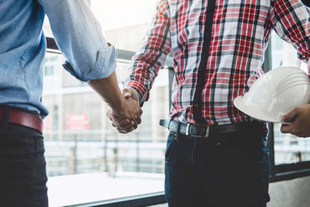Meeting and greeting, Two engineer or architect meeting for project, handshake after consultation and conference new project plan, contract for both companies, success, partnership.の写真素材