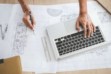 Construction concept, Hands of architect or engineer working for new project plan on blueprint,...