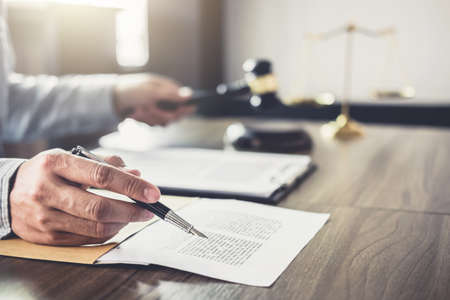 Judge gavel with Justice lawyers, Businessman in suit or lawyer working on a documents in courtroom....