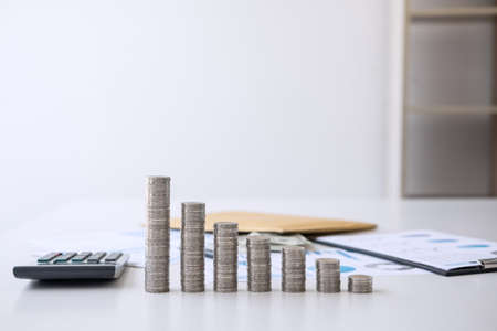 Stock financial indices and growth stacking coin and financial costs wisely and carefully, investment and saving concept.の写真素材