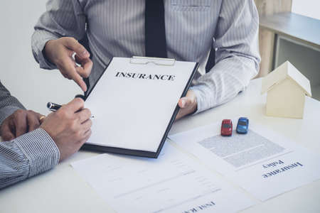 Car and Home insurance concept, broker agent presenting and consult to customer to decision making...