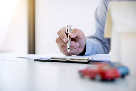 Real estate broker residential agent being making the decision a car and home estate loan rent listing contract.の写真素材