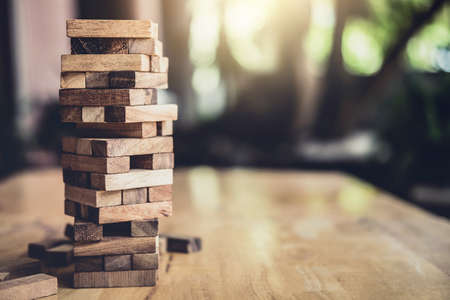 Wood block on the tower, Alternative risk concept, plan and strategy in business, Risk To Make Business Growth Concept With Wooden Blocks.の写真素材