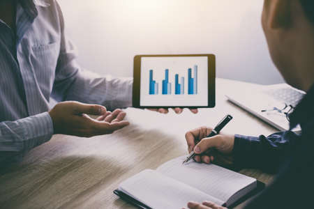 Two business executive conference presentation report of new plan marketing to development...