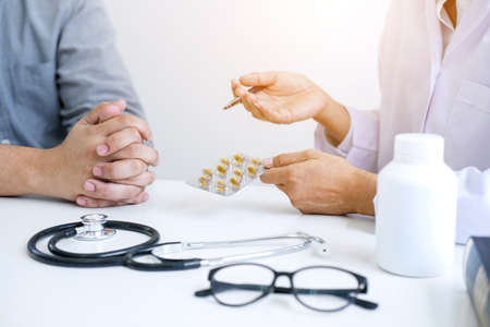 Doctor consulting patient and recommend treatment methods and how to rehabilitate the body and use...