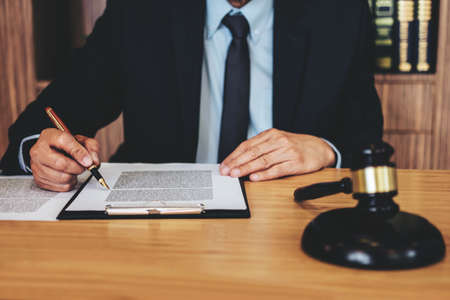 Judge gavel with Justice lawyers, Businessman in suit or lawyer working on a documents. Legal law,...