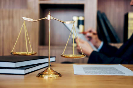 Judge gavel with Justice lawyers, Businessman in suit or lawyer working on a documents. Legal law, advice and justice concept.の写真素材
