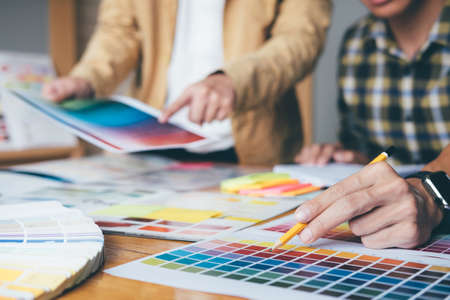 Young creative team having a meeting in creative office, Architectural drawing with work tools and...