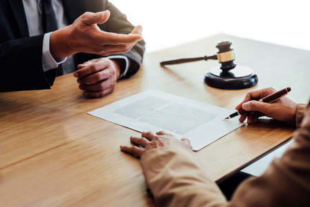 Customer service good cooperation, Consultation between a Businesswoman and Male lawyer or judge consult having team meeting with client, Law and Legal services concept.の写真素材
