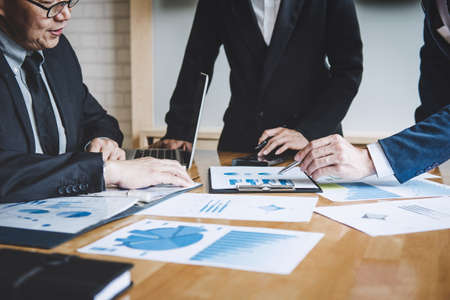 Co working conference, Business team colleagues discussing working analysis with financial data and marketing growth report graph in team, Business finances and accounting concept.の写真素材