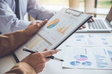 Business people conference and discussing the charts and graphs showing the results of their successful teamwork, business concept.の写真素材