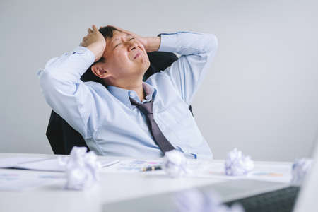 Feeling sick and tired, Senior businessman depressed and exhausted, businessman at his desk...