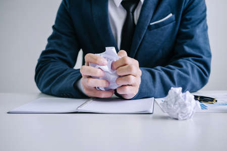 Feeling sick and tired, Businessman depressed and exhausted at his desk frustrated with problems...