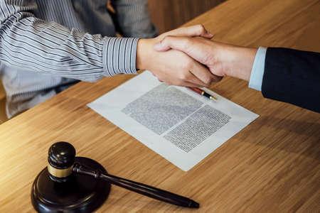 Shaking hands after good cooperation, Businessman handshake male lawyer after discussing good deal...